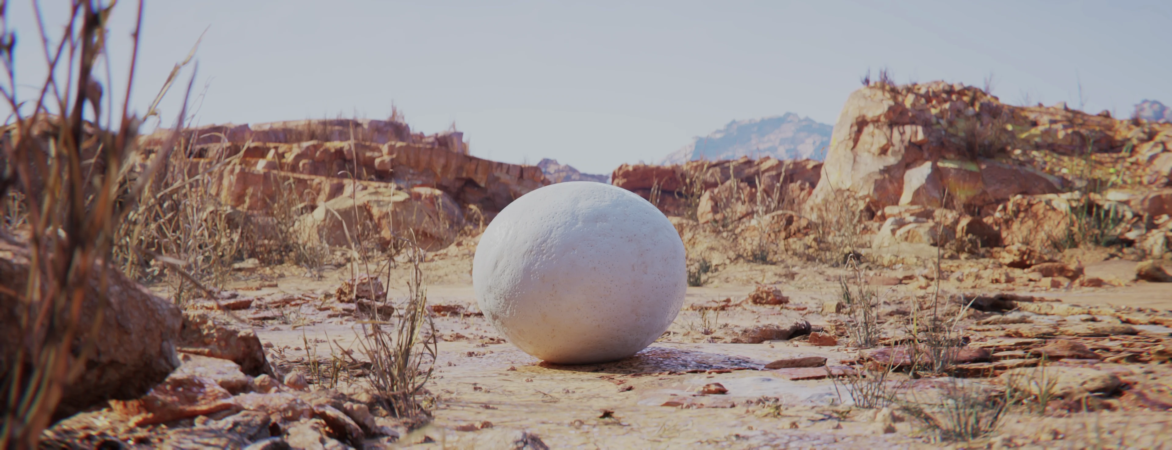 A large egg sits alone in a desert